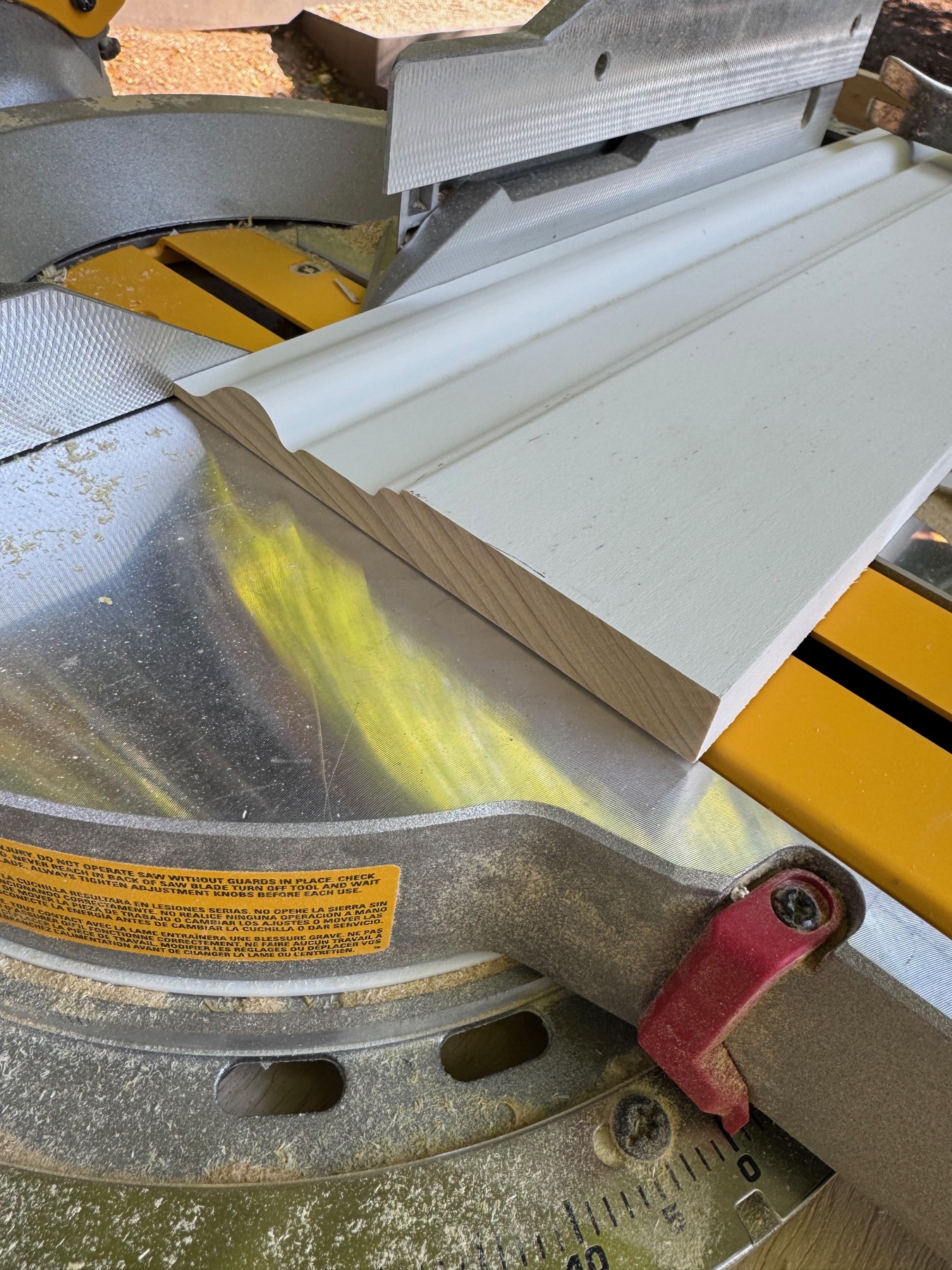 Custom molding profile being cut to length on a miter saw